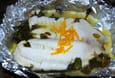 Papillote de colin, lit de m�che et beurre d orange