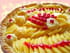 Tarte aux mangues sur coulis de fruits rouges